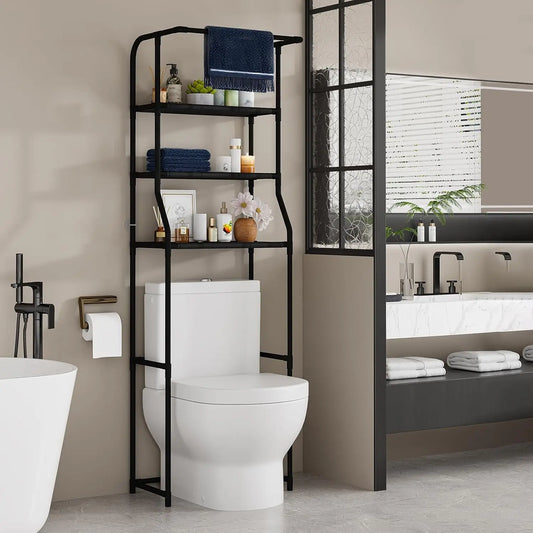Black 3 tier over the toilet storage shelf holding towels and toiletries above a standard toilet